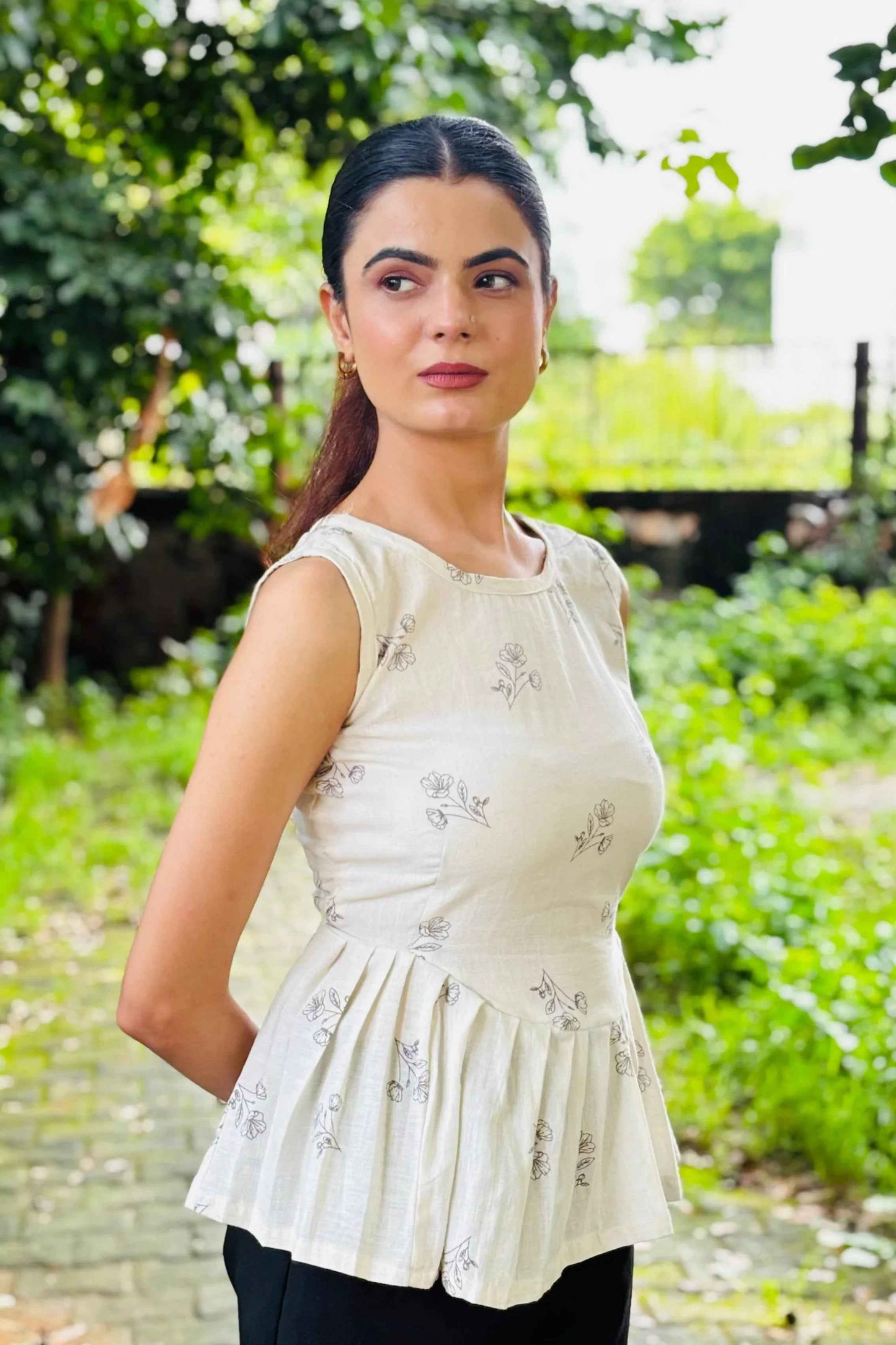 White Sleeveless Peplum Top with Subtle Floral Print – Casual & Office Wear - Folkiss