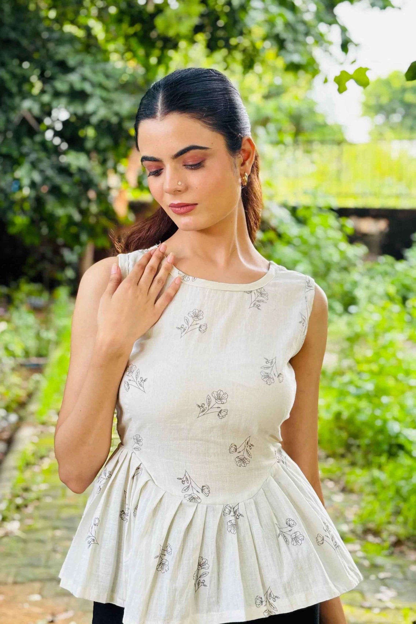 White Sleeveless Peplum Top with Subtle Floral Print – Casual & Office Wear - Folkiss