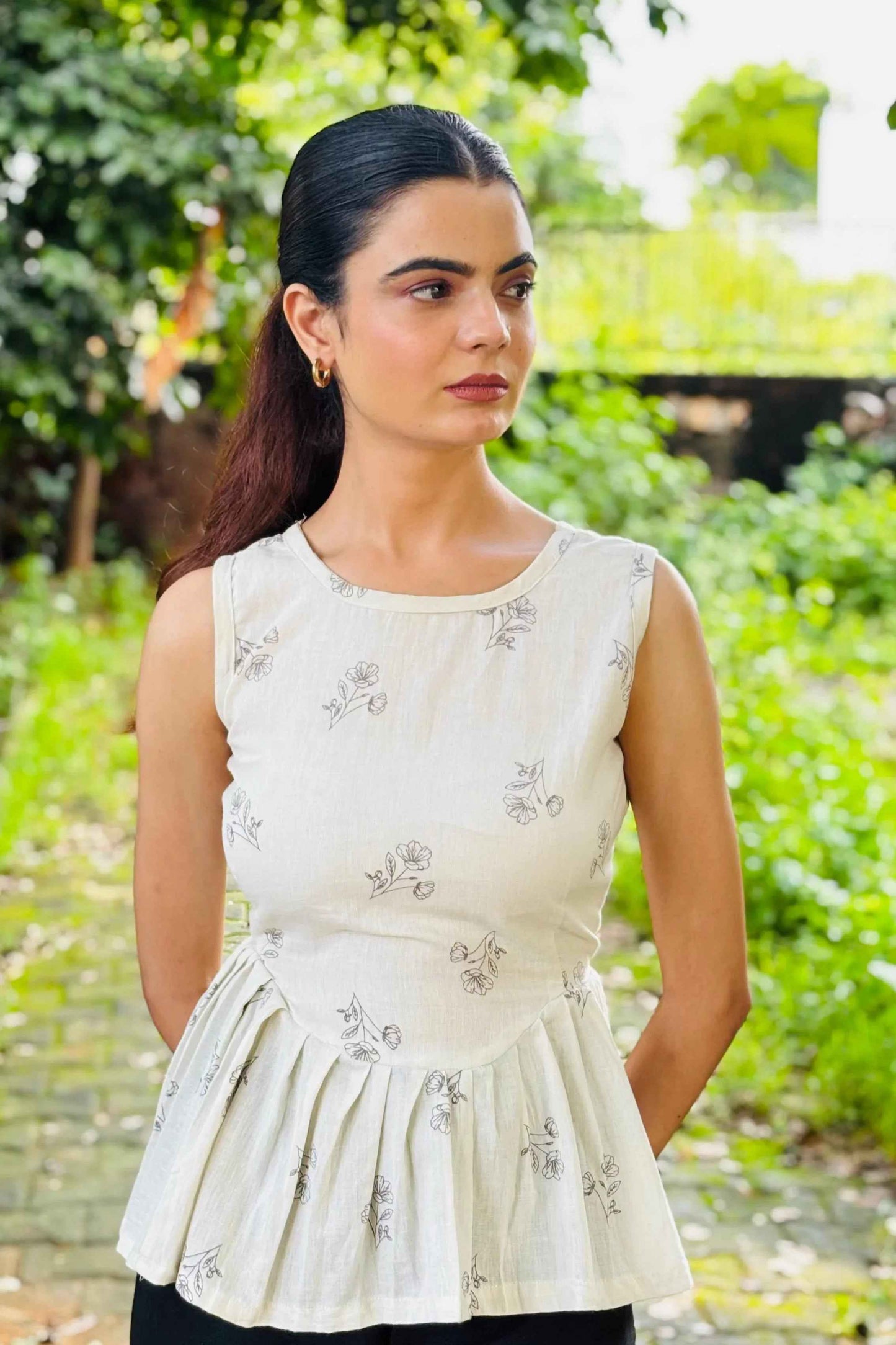 White Sleeveless Peplum Top with Subtle Floral Print – Casual & Office Wear - Folkiss