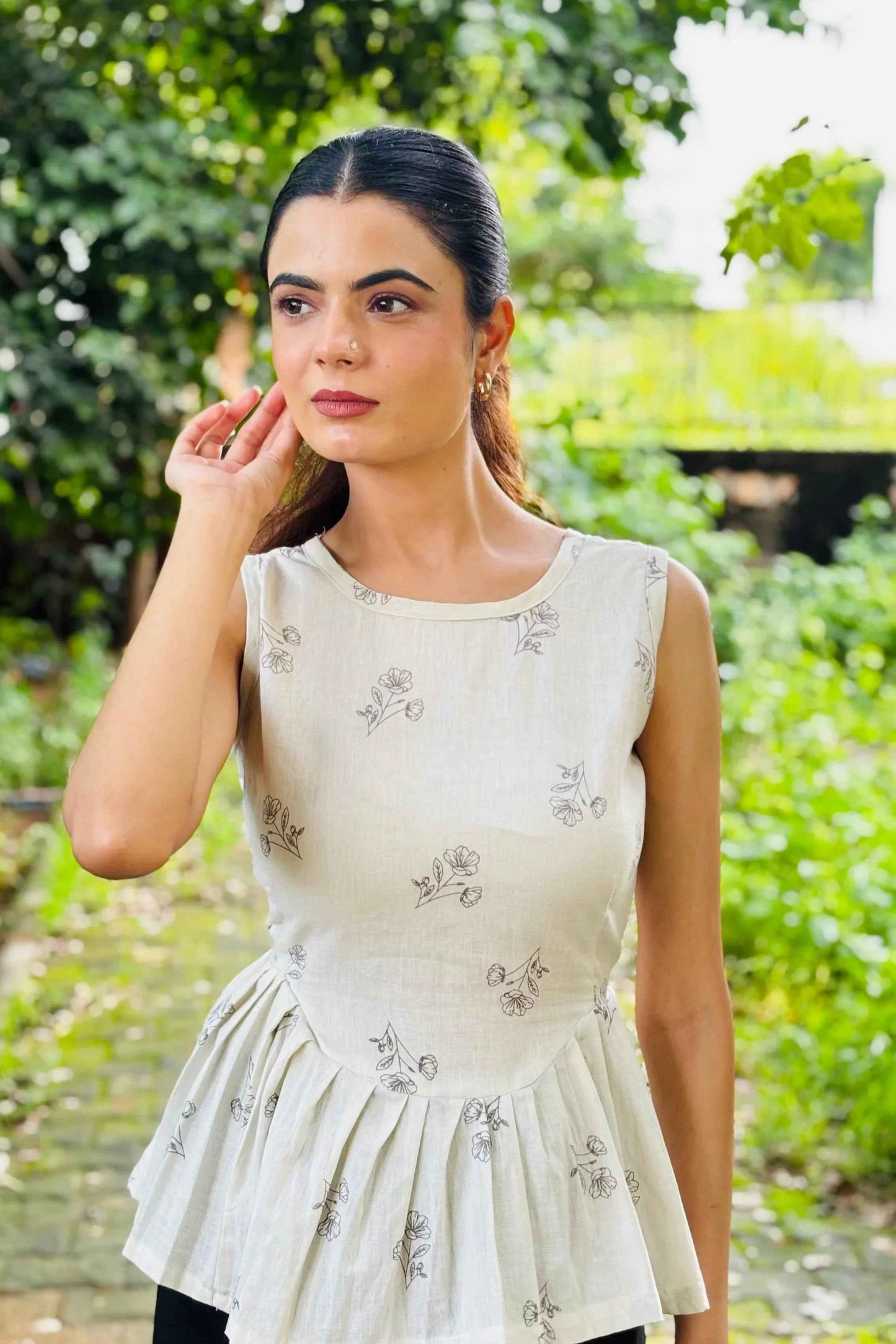 White Sleeveless Peplum Top with Subtle Floral Print – Casual & Office Wear - Folkiss